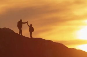 two people high-fiving