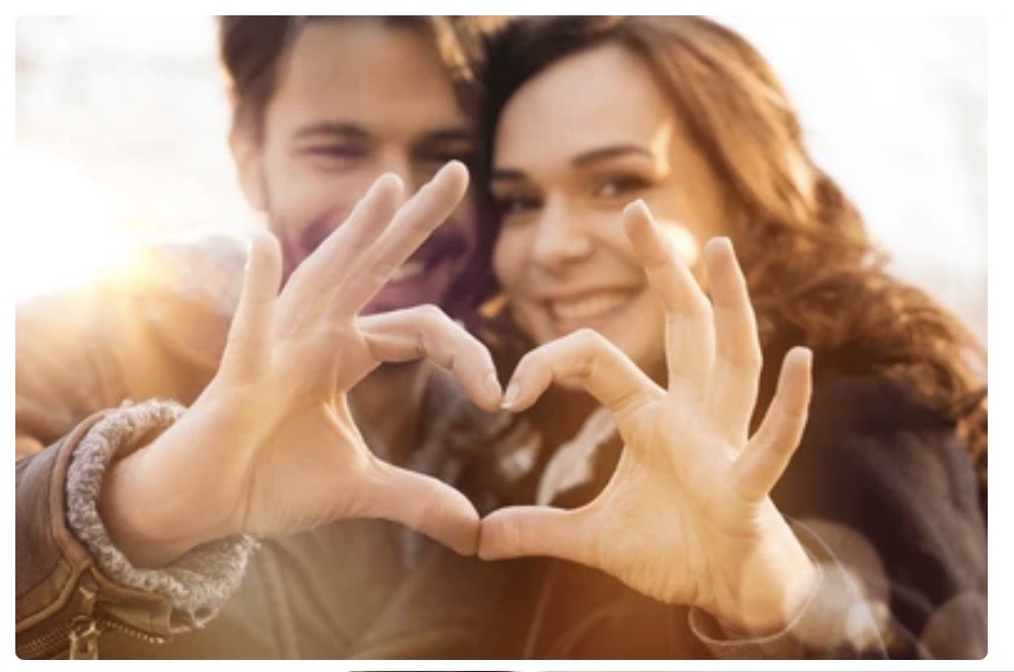 couple making heart with hands